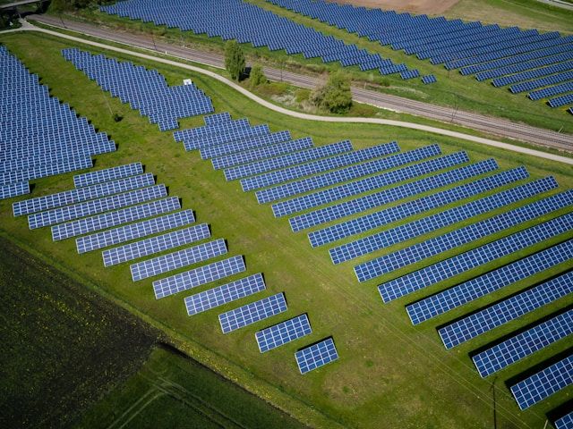 fields covered in solar panels - sustainability